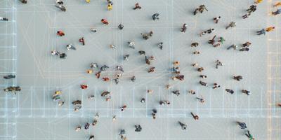 Drone perspective of a group of people connected through digital networks